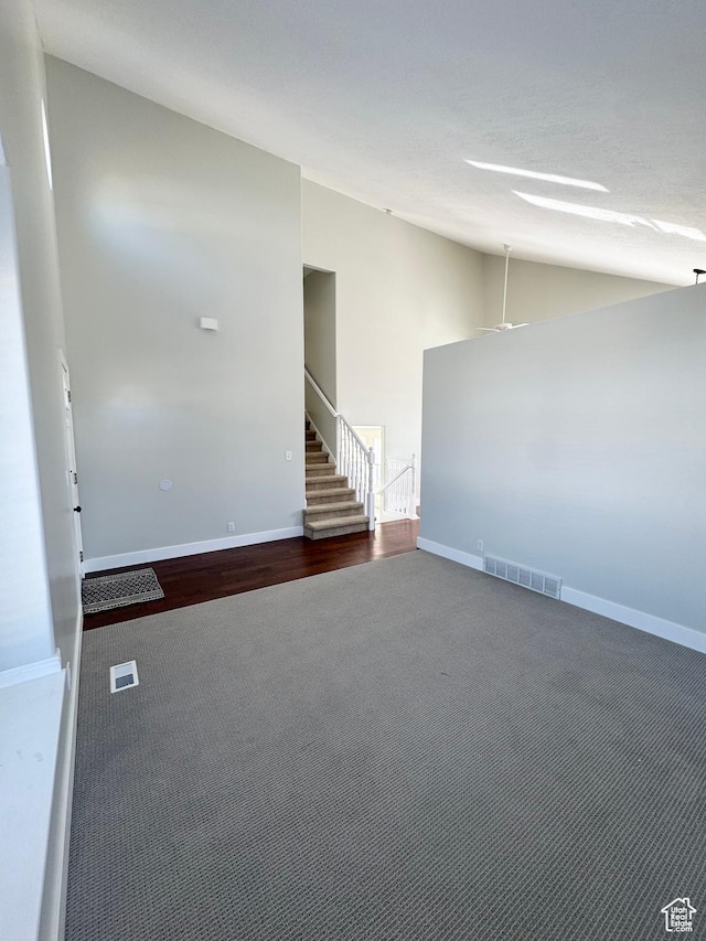 1668 N Lewis And Clark Dr, Centerville, UT 84014 - carpeted spare room with lofted ceiling, visible vents, baseboards, and stairs