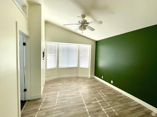 1668 N Lewis And Clark Dr, Centerville, UT 84014 - empty room with ceiling fan, baseboards, vaulted ceiling, and wood finished floors