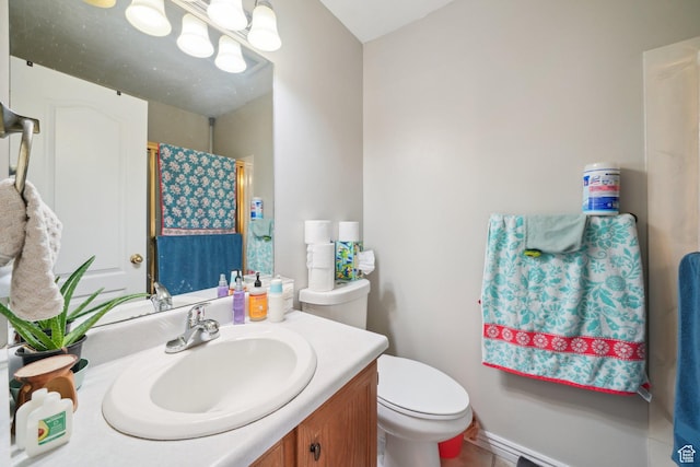 bathroom with vanity, a shower with shower curtain, and toilet