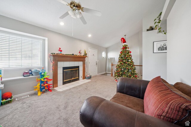 living room with a fireplace, carpet floors, ceiling fan, and lofted ceiling