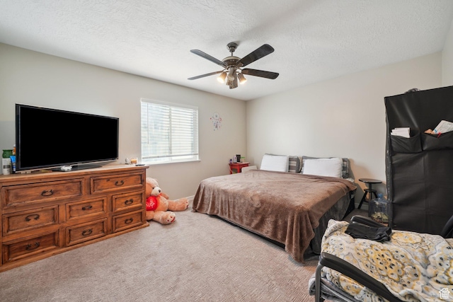 bedroom with light carpet, a textured ceiling, and ceiling fan