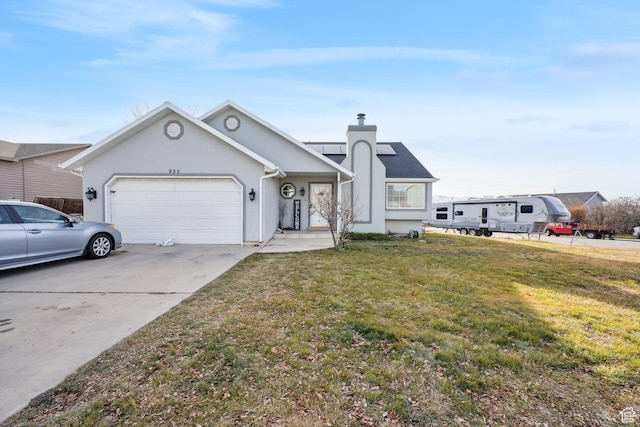 view of front facade with a front yard and a garage