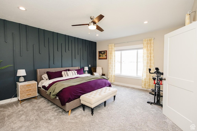 bedroom with ceiling fan and light colored carpet
