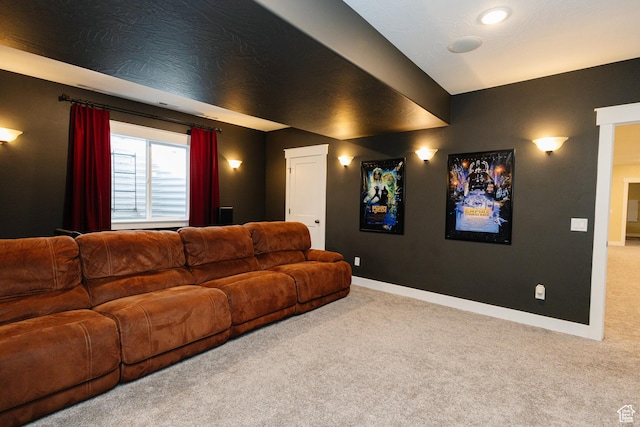 home theater room featuring light carpet