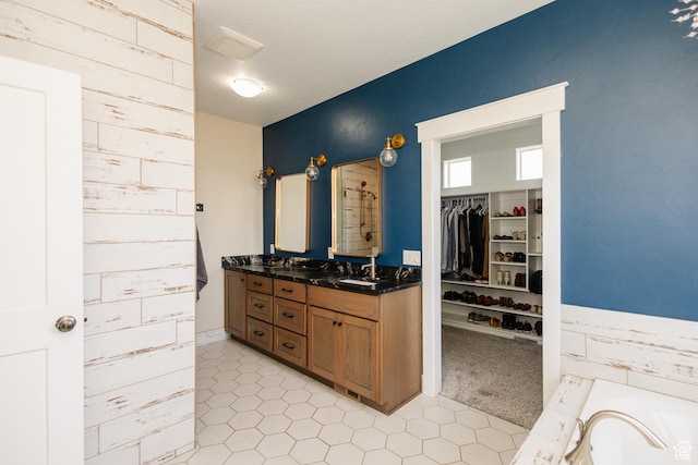 bathroom with vanity and a bathing tub
