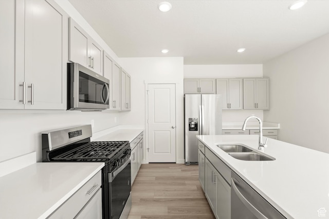 1367 N Harper Way Unit 0248, Tooele, UT 84074 - kitchen with appliances with stainless steel finishes, light wood finished floors, light countertops, and recessed lighting