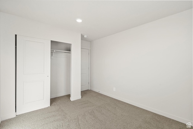 1367 N Harper Way Unit 0248, Tooele, UT 84074 - unfurnished bedroom with light carpet, a closet, and recessed lighting