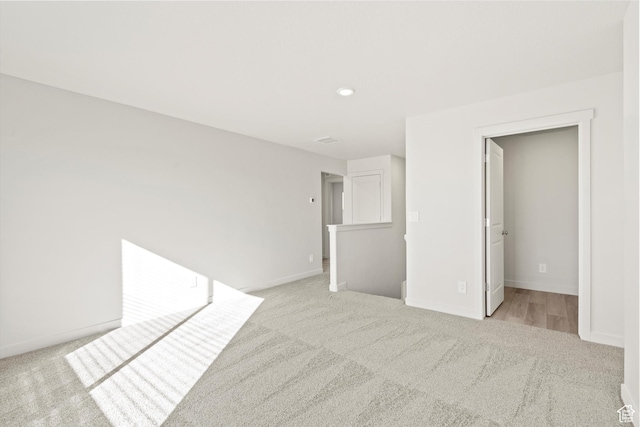 1367 N Harper Way Unit 0248, Tooele, UT 84074 - unfurnished bedroom featuring light carpet and recessed lighting