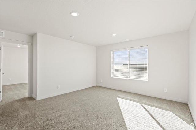 1367 N Harper Way Unit 0248, Tooele, UT 84074 - spare room with light carpet and recessed lighting