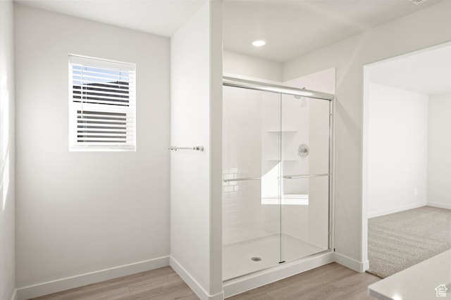 1367 N Harper Way Unit 0248, Tooele, UT 84074 - bathroom with wood finished floors, a stall shower, and recessed lighting