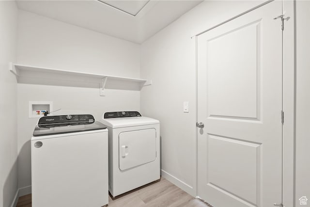 1367 N Harper Way Unit 0248, Tooele, UT 84074 - laundry room with light wood-style floors and washer and clothes dryer