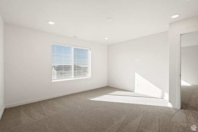 1367 N Harper Way Unit 0248, Tooele, UT 84074 - empty room featuring carpet floors and recessed lighting