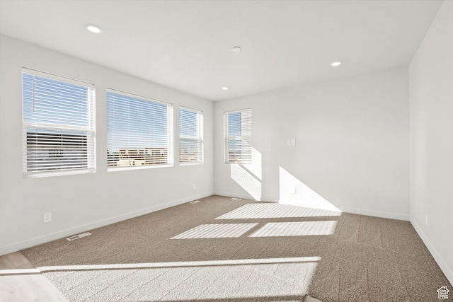 1367 N Harper Way Unit 0248, Tooele, UT 84074 - empty room featuring carpet and recessed lighting