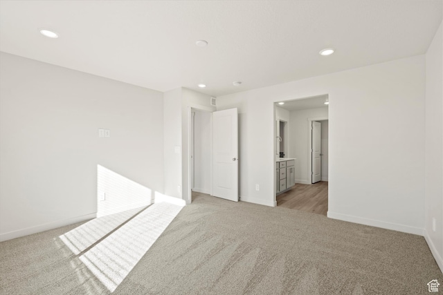 1367 N Harper Way Unit 0248, Tooele, UT 84074 - unfurnished room featuring light colored carpet and recessed lighting