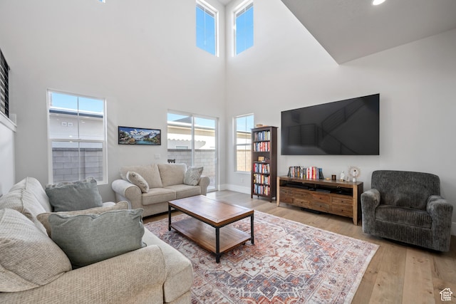 5629 S Adobe Sun Dr, St George, UT 84790 - living room with a high ceiling and light hardwood / wood-style floors