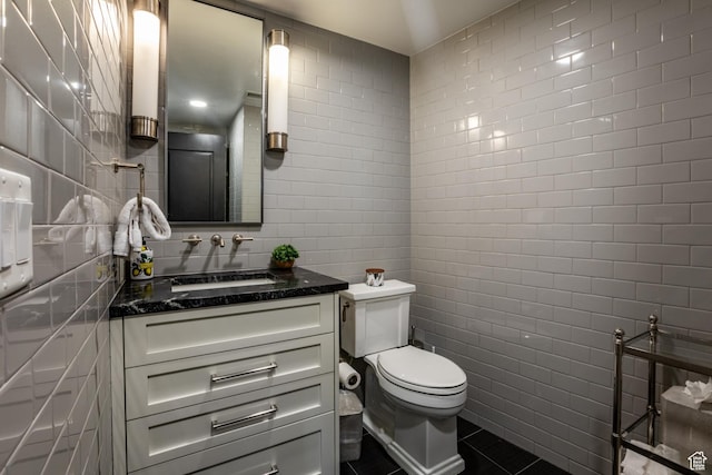 692 Main St Unit D, Park City, UT 84060 - bathroom with vanity, toilet, and tile walls