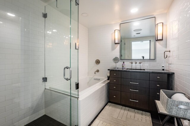 692 Main St Unit D, Park City, UT 84060 - bathroom featuring tile patterned flooring, vanity, tile walls, and shower with separate bathtub