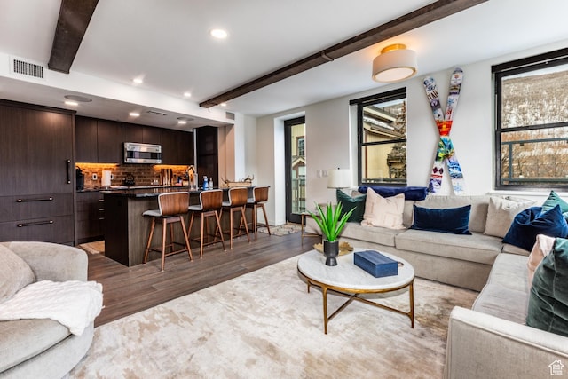 692 Main St Unit D, Park City, UT 84060 - living room featuring beam ceiling and dark wood-type flooring