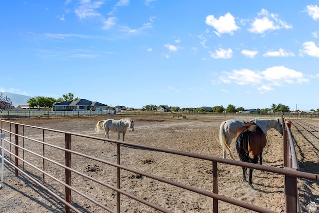 view of stable featuring a rural view