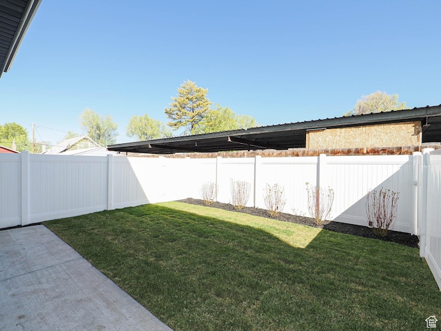 view of yard with a fenced backyard and a patio area