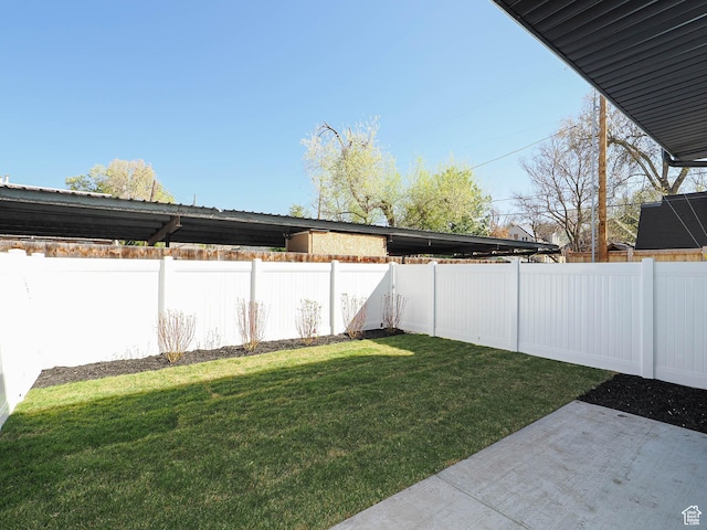 view of yard with a fenced backyard