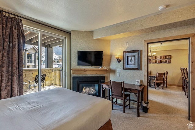2669 Canyons Resort Dr Unit 308, Park City, UT 84098 - carpeted bedroom with a textured ceiling and a notable chandelier