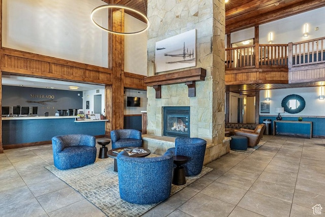 2669 Canyons Resort Dr Unit 308, Park City, UT 84098 - living room with a fireplace, light tile patterned flooring, and a high ceiling