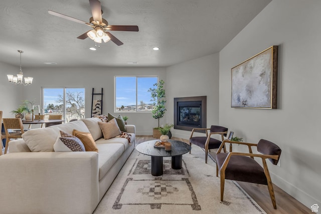 195 E 360 N Unit 13B, Fillmore, UT 84631 - living room featuring light hardwood / wood-style floors and ceiling fan with notable chandelier