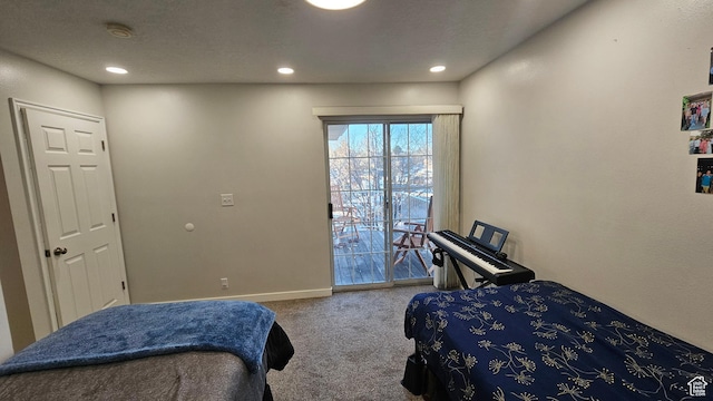 carpeted bedroom with access to exterior