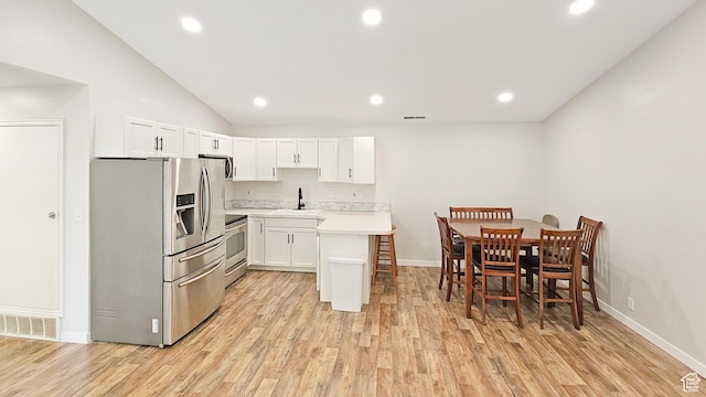 1303 N Riverside Ave Unit 36, Provo, UT 84604 - kitchen featuring stainless steel fridge with ice dispenser, range, light wood-style floors, light countertops, and recessed lighting