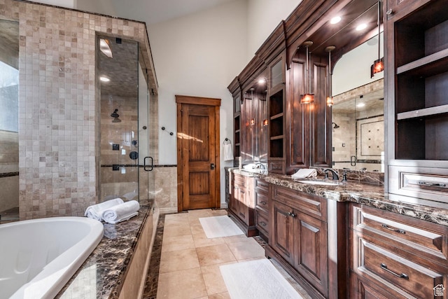 26 White Pine Canyon Rd, Park City, UT 84060 - bathroom featuring tile patterned floors, vanity, and plus walk in shower