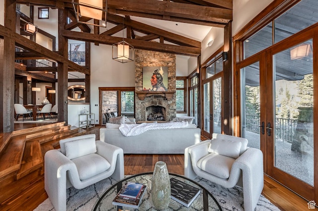 26 White Pine Canyon Rd, Park City, UT 84060 - living room with wood-type flooring, a fireplace, high vaulted ceiling, and french doors