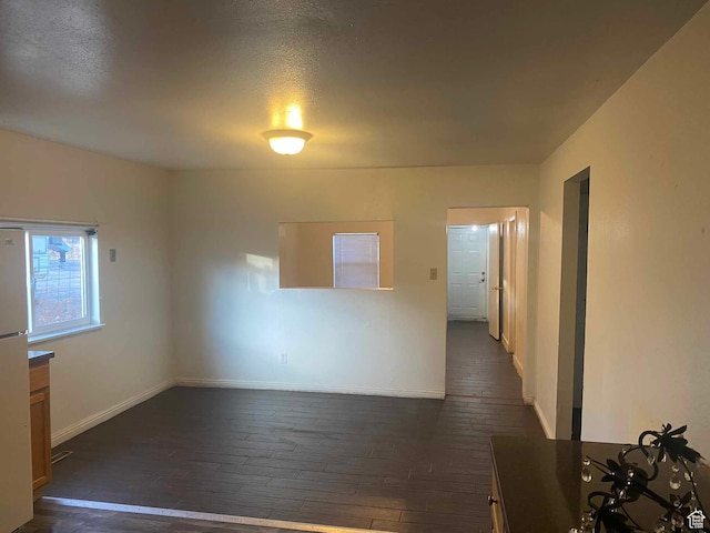 312 N 500 E, Vernal, UT 84078 - spare room with a textured ceiling and dark hardwood / wood-style floors
