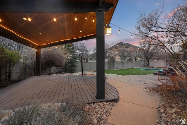13234 S Lone Rock Dr E, Draper, UT 84020 - patio terrace at dusk featuring a lawn