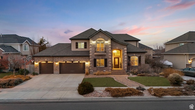 13234 S Lone Rock Dr E, Draper, UT 84020 - view of front of home with a yard, a balcony, and a garage