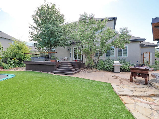 13234 S Lone Rock Dr E, Draper, UT 84020 - back of house featuring a wooden deck, a patio area, and a lawn