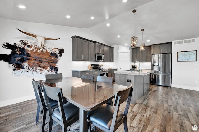 1021 N 600 E, Morgan, UT 84050 - dining room with recessed lighting, light wood-style flooring, vaulted ceiling, and baseboards
