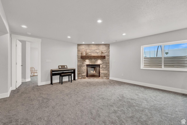 1021 N 600 E, Morgan, UT 84050 - living room with carpet, a fireplace, baseboards, and recessed lighting