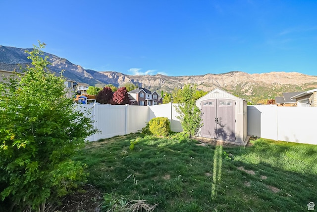 3568 N 500 E, North Ogden, UT 84414 - view of yard featuring a mountain view, a shed, and an outdoor structure