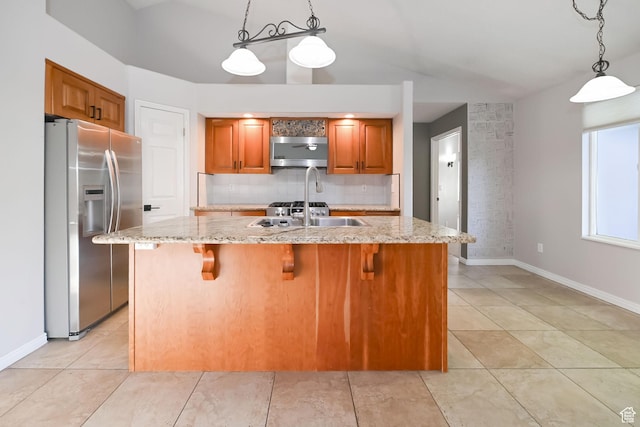 3568 N 500 E, North Ogden, UT 84414 - kitchen featuring stainless steel refrigerator with ice dispenser, backsplash, light stone countertops, brown cabinetry, and hanging light fixtures