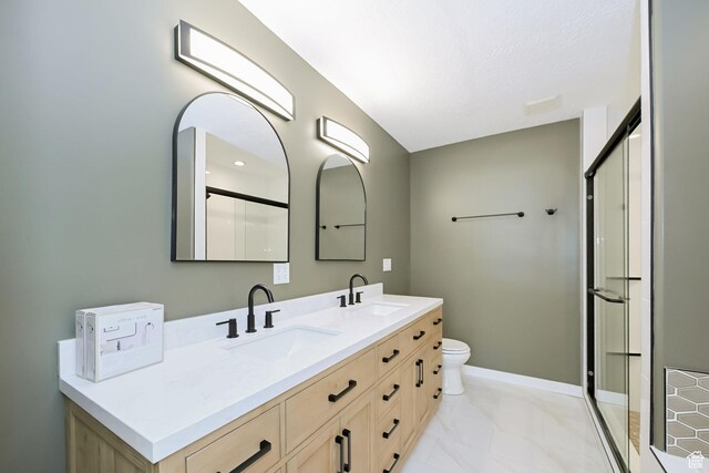 3568 N 500 E, North Ogden, UT 84414 - full bathroom with a stall shower, double vanity, marble look tiles, and toilet