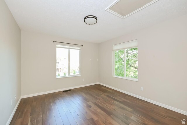 3568 N 500 E, North Ogden, UT 84414 - empty room with plenty of natural light, baseboards, and dark wood-style floors