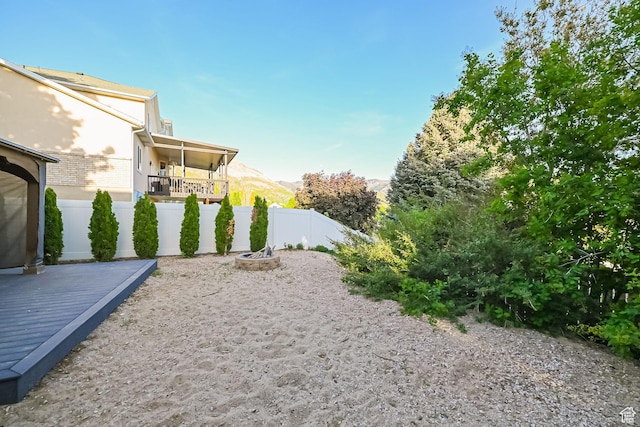 3568 N 500 E, North Ogden, UT 84414 - view of yard featuring fence and a deck with mountain view