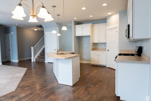 1645 W 430 N, Lindon, UT 84042 - kitchen featuring sink, white cabinetry, hanging light fixtures, and an island with sink