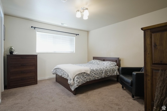 bedroom with light colored carpet