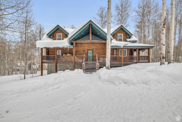 cabin featuring covered porch