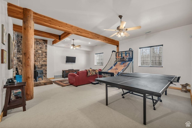 4125 S Buck Way Unit 1958, Heber City, UT 84032 - rec room with beamed ceiling, ceiling fan, a wood stove, and light carpet