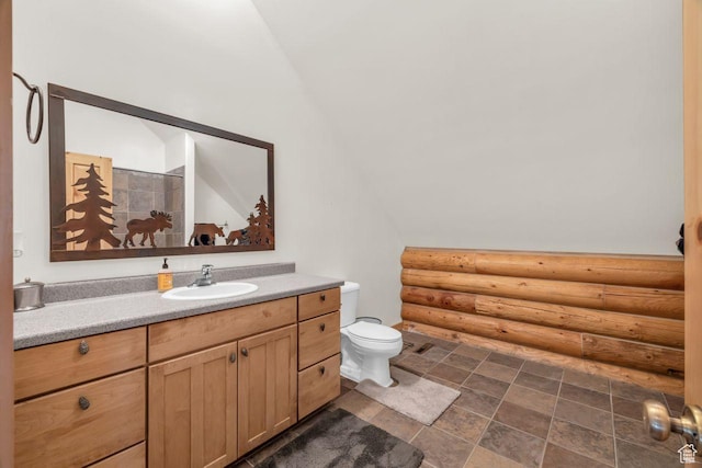 4125 S Buck Way Unit 1958, Heber City, UT 84032 - bathroom featuring log walls, vanity, toilet, and lofted ceiling