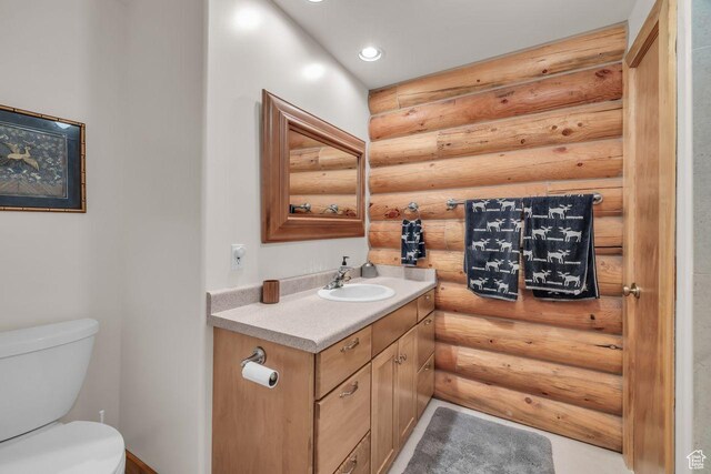 4125 S Buck Way Unit 1958, Heber City, UT 84032 - bathroom featuring vanity, log walls, and toilet