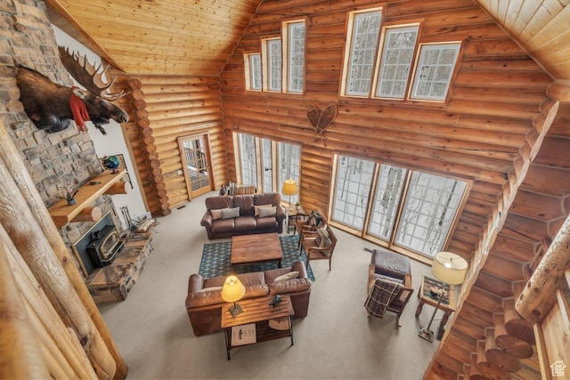 4125 S Buck Way Unit 1958, Heber City, UT 84032 - living room with carpet flooring, a wood stove, log walls, wooden ceiling, and vaulted ceiling